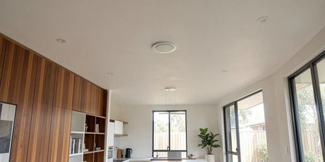 Modern Australian home interior showing a seamless painted ceiling with a flush frameless diffuser, invisible against the plasterboard